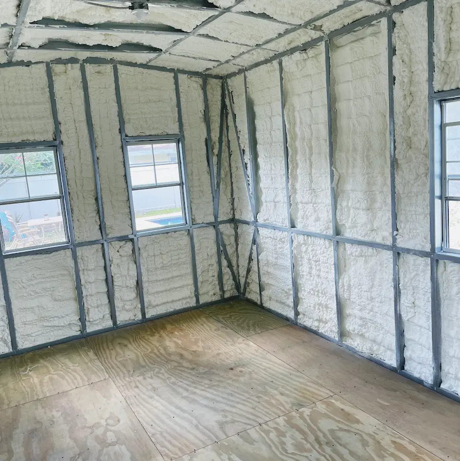 Closed-cell spray foam insulation applied to wall cavities in a residential project in Winnetka